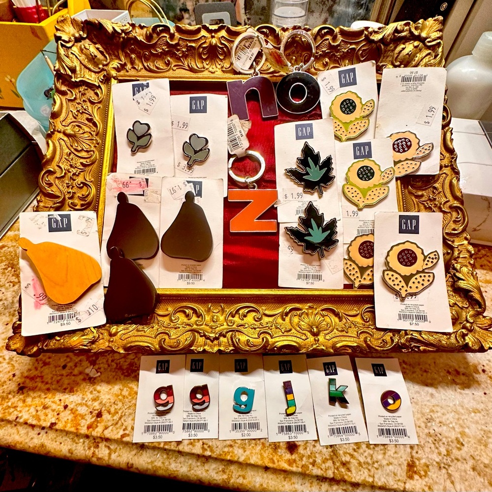 22 Pins and keychains from the Gap. All new.